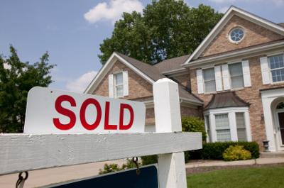 How do you record the sale of real estate when financing is provided?