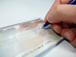 Company cheque or credit card used to purchase personal expenses