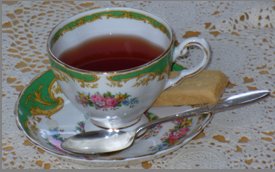 A bookkeeper's break - tea and shortbread served in Grandma's teacup!