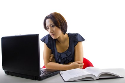 A small business owner taking an online bookkeeping course.