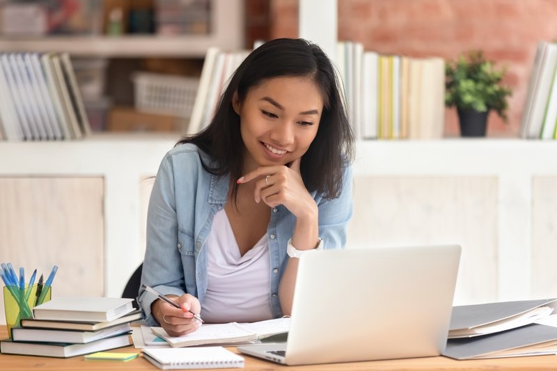 Small business owner sitting in front of her laptop