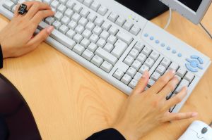 Woman performing basic bookkeeping entries